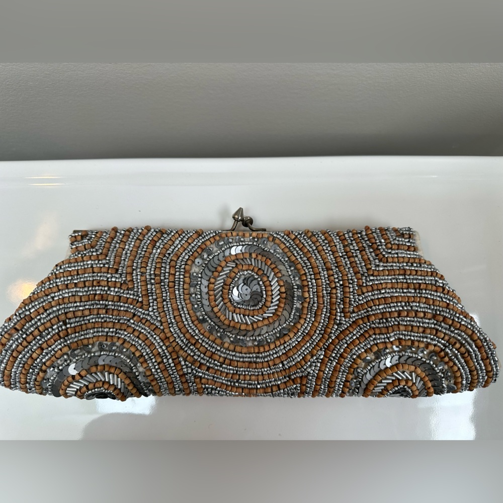 Beautiful WHITE HOUSE BLACK MARKET clutch with silver and neutral beading detail